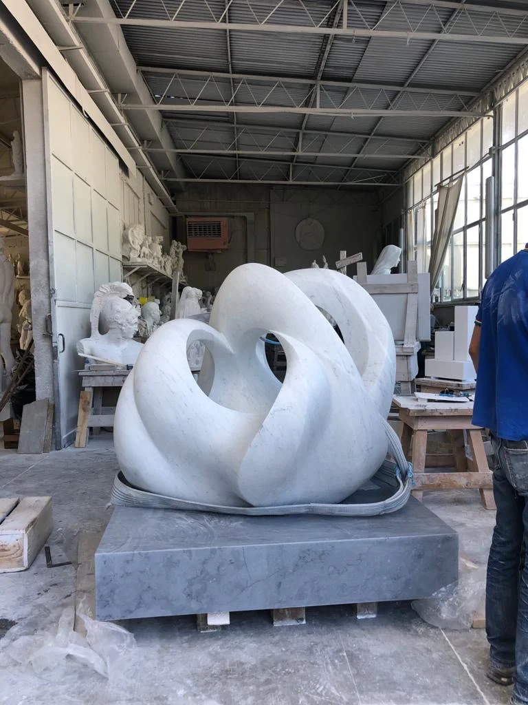 White marble sculpture inside a Pietrasanta workshop